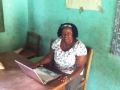 Ms Koroma (Deputy Head) with laptop donated by Dobbs